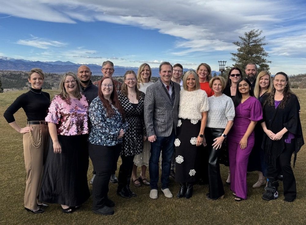 The Ascent home office team standing together outdoors